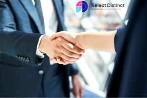 Business consultancy partnership meeting with professionals shaking hands to discuss reporting, analytics and business intelligence support services